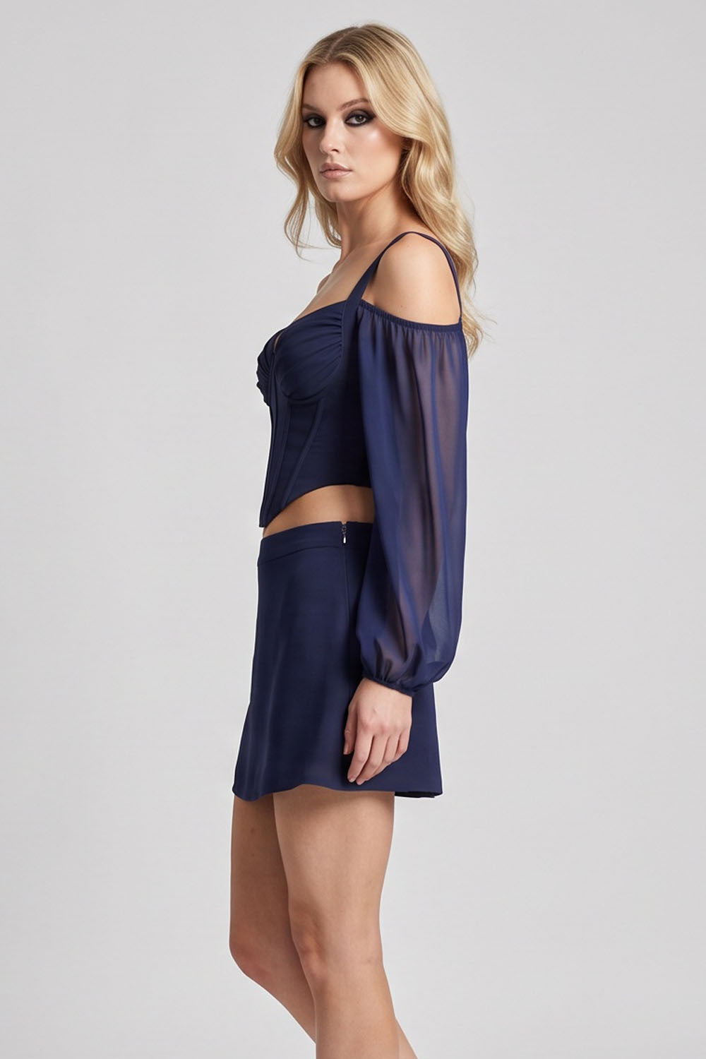 MAEVE Corset Top & Mini Skirt Co-ord Set in Navy on model – side view