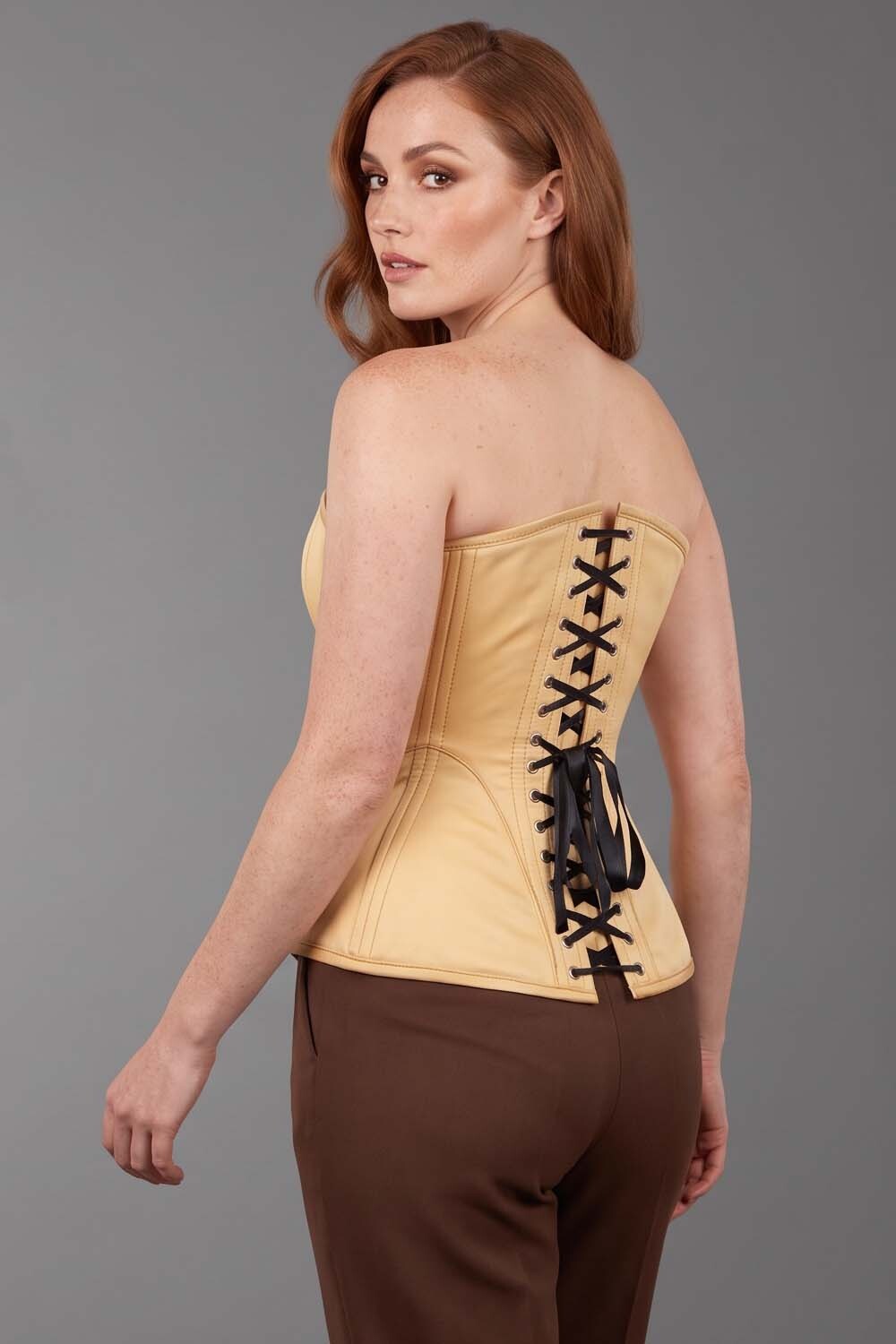 ASTER Overbust Waist-Training Corset in Nude Satin on model – back view